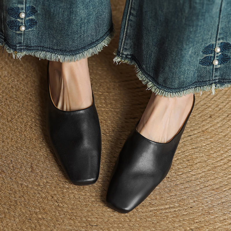 Trendy silver square-toe block heel mules. Women's fashion slip-on shoes for a modern, chic, and comfortable style.