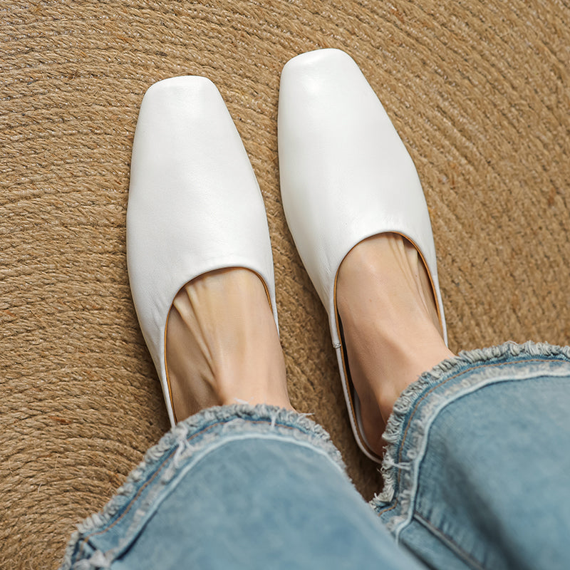 Women's block heel mules with a contemporary square toe. Comfortable, chic slip-on shoes for versatile fashion.