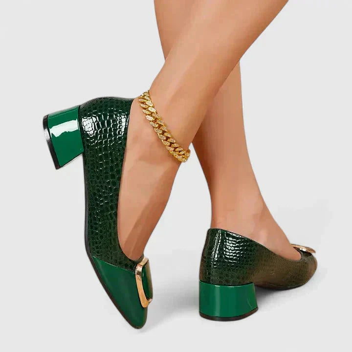 Close-up of women's croc embossed square toe loafers. Chic block heel slip-on dress shoes for office wear.