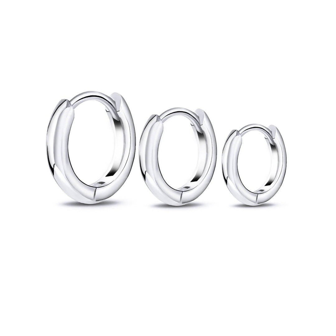 Women's stackable hoop earring set: sterling silver & gold-plated hoops for versatile, minimalist style.