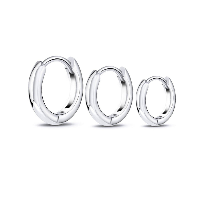 Women's stackable hoop earring set: sterling silver & gold-plated hoops for versatile, minimalist style.