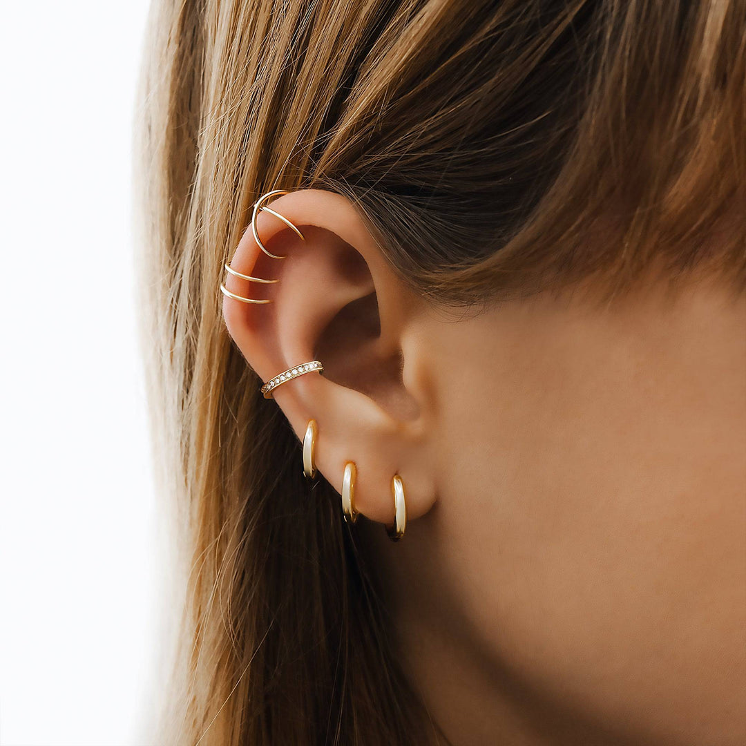 Elegant 3-ring hoop earring set for women, featuring sterling silver & gold-plated finishes. Perfect fashion jewelry.