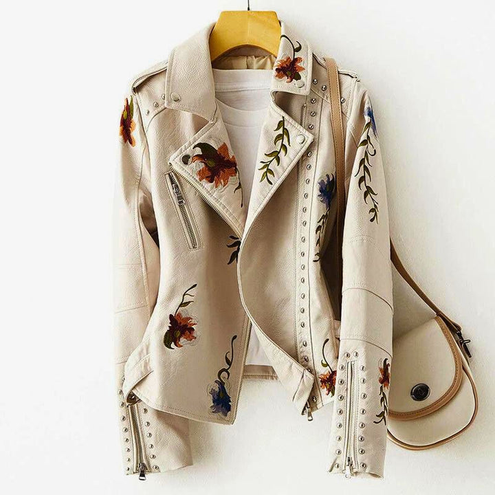 Women's statement jacket, richly embroidered with floral patterns & edgy studs. Perfect for bold, fashionable outerwear.