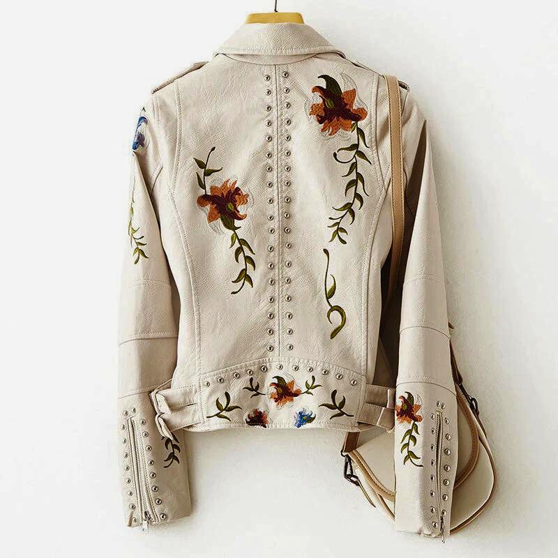 Black women's embroidered jacket with bold studs for an edgy statement. Stylish floral outerwear.