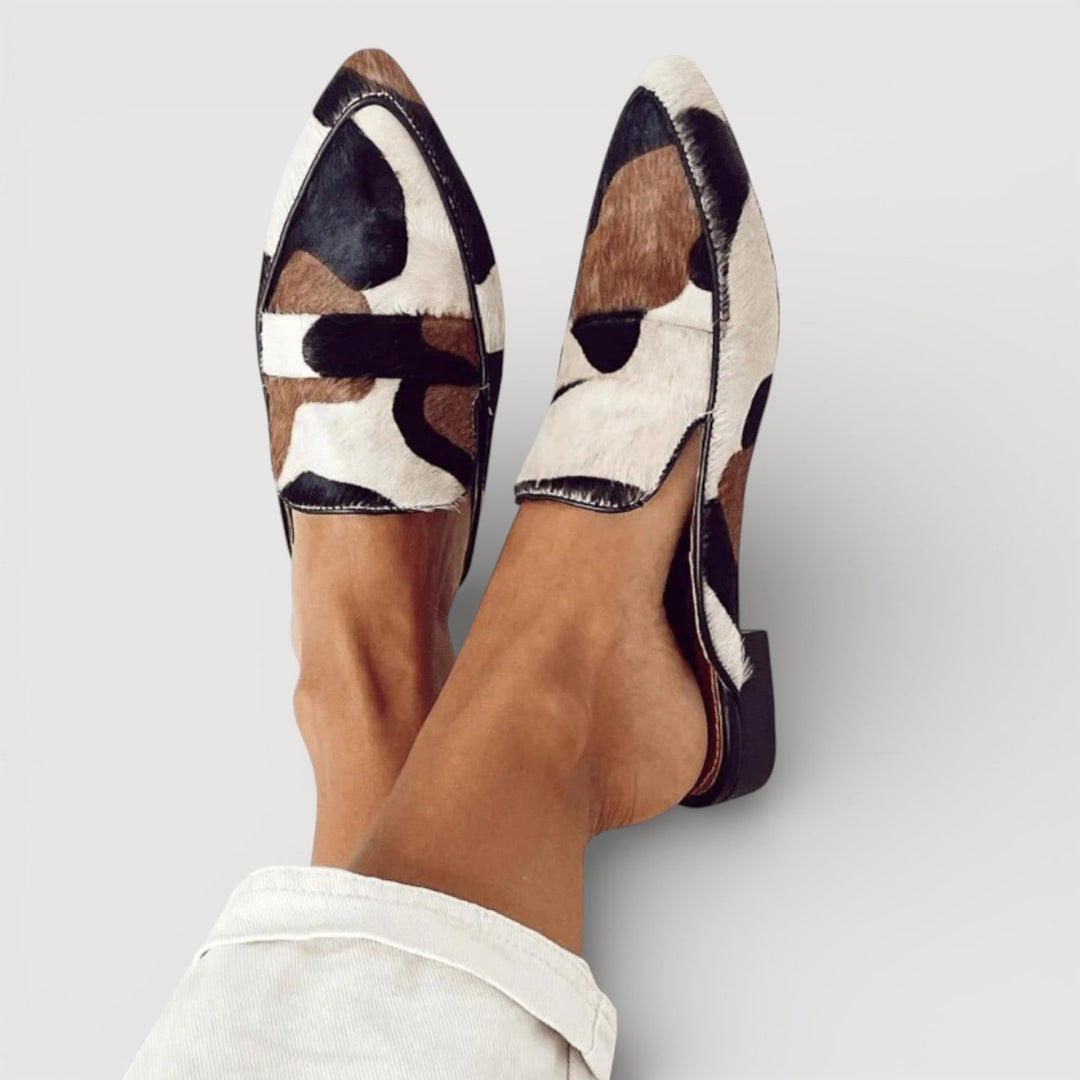 Women's statement loafers with modern abstract pattern, comfortable slip-on design for casual chic or office wear.