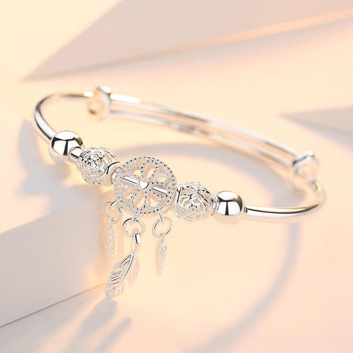 Women's sterling silver adjustable dreamcatcher bracelet, perfect boho jewelry for protection & style.