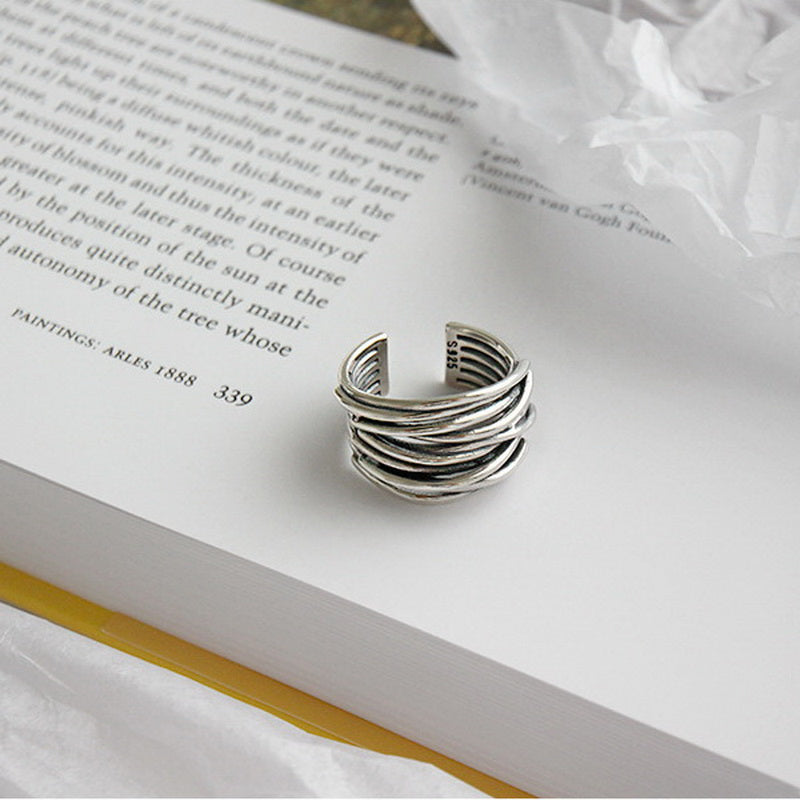 Minimalist women's silver layered ring, adjustable design, ideal modern sterling silver jewelry gift.