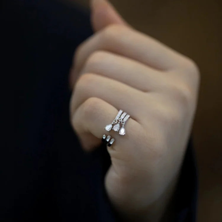 Women's sterling silver adjustable water drop ring, elegant and minimalist open design, perfect for versatile wear.