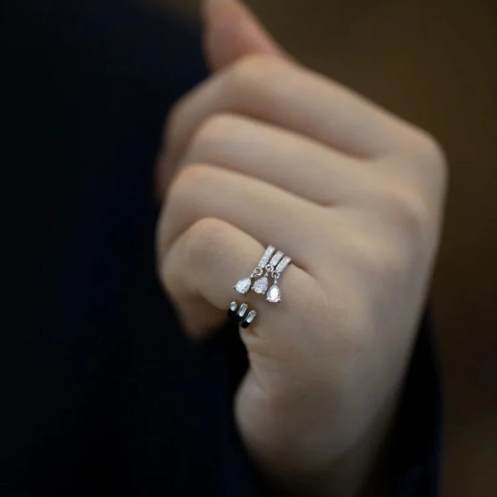 Women's sterling silver adjustable water drop ring, elegant and minimalist open design, perfect for versatile wear.