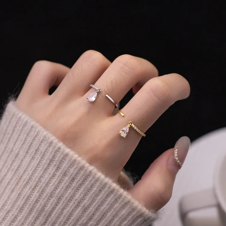 Delicate water drop open ring in sterling silver, an elegant and minimalist adjustable ring for women.