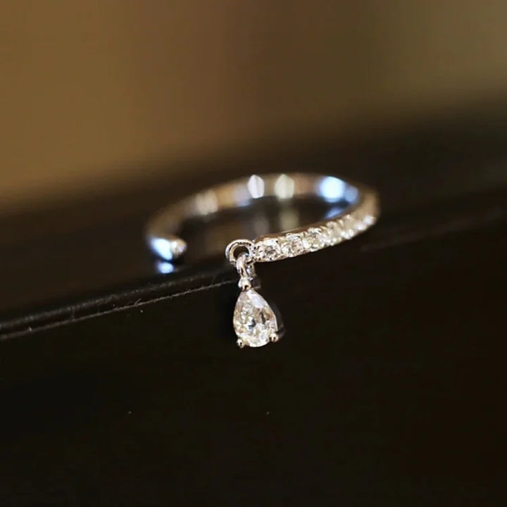 Sparkling water drop adjustable ring, sterling silver, elegant and minimalist jewelry for modern women.