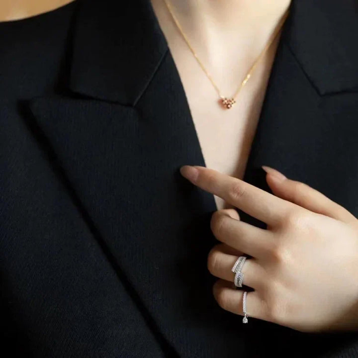 Modern women's sterling silver open ring, featuring an elegant adjustable water drop design, minimalist style.
