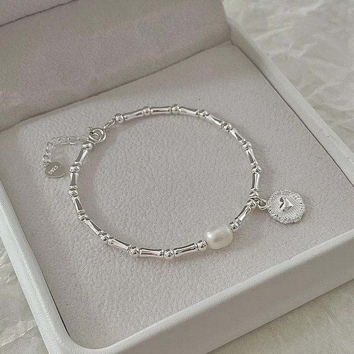 Women's sterling silver bamboo bead knot bracelet, elegant and durable, perfect for everyday wear.