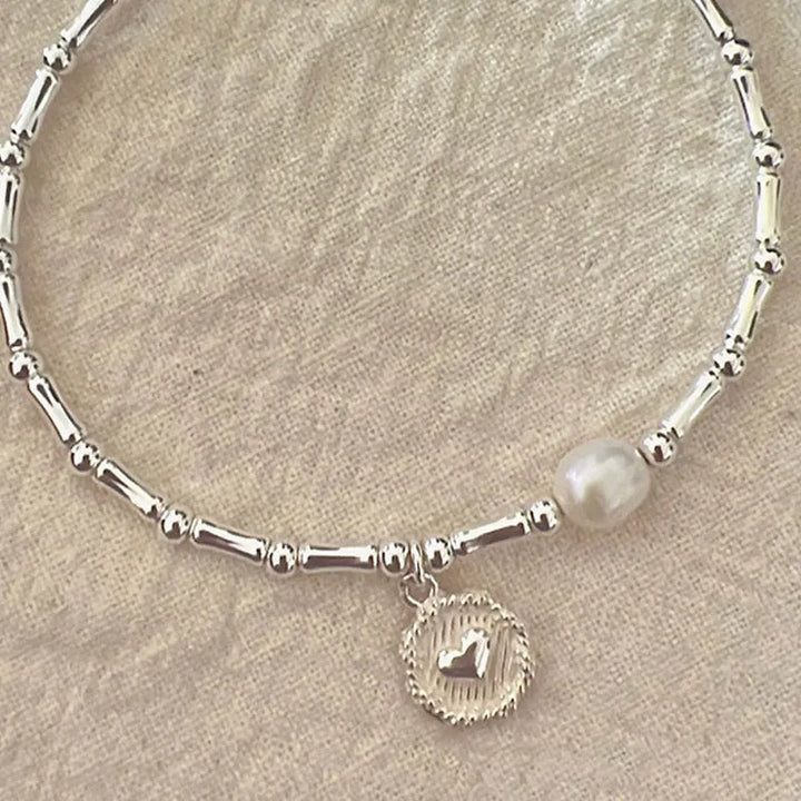 Sterling silver bamboo bead knot bracelet for women, adjustable and hypoallergenic, showcasing fine craftsmanship.