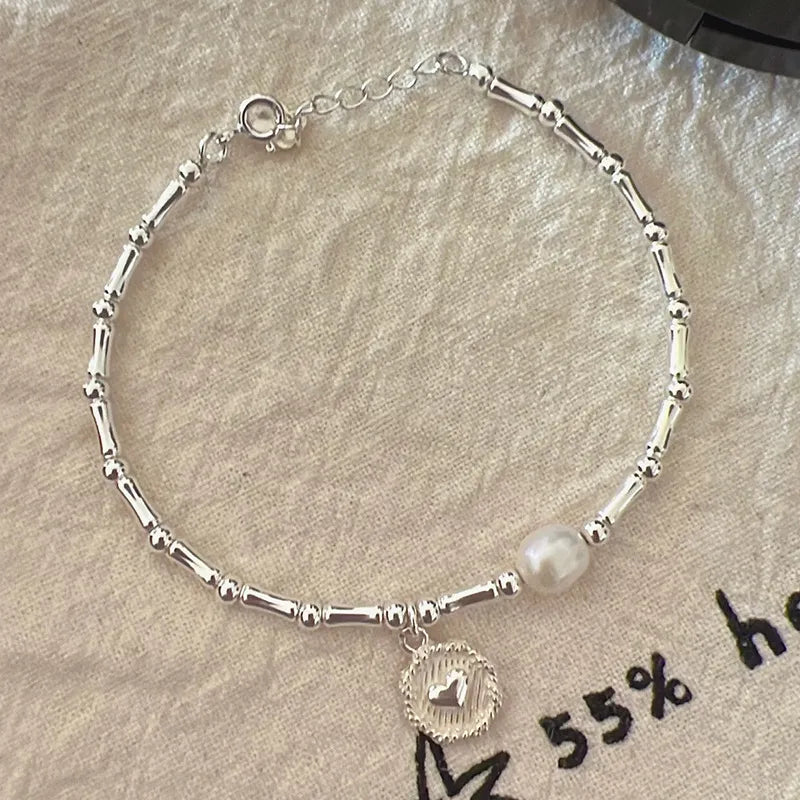 Elegant women's sterling silver bamboo bead knot bracelet, durable and versatile, a timeless piece of jewelry.
