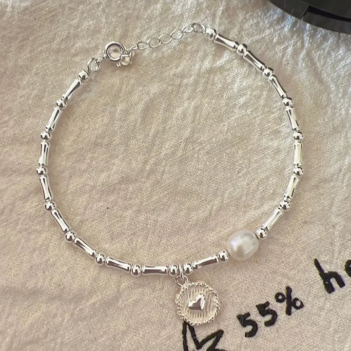 Elegant women's sterling silver bamboo bead knot bracelet, durable and versatile, a timeless piece of jewelry.