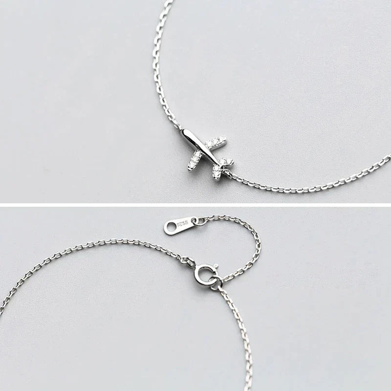 Adventure-inspired women's silver bracelet with plane charm, a thoughtful gift for wanderlust spirits and travelers.