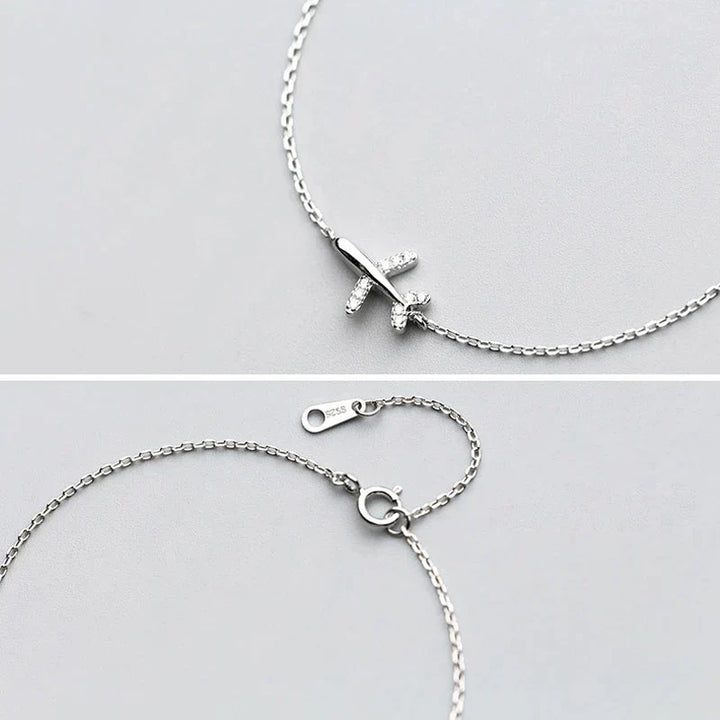 Adventure-inspired women's silver bracelet with plane charm, a thoughtful gift for wanderlust spirits and travelers.