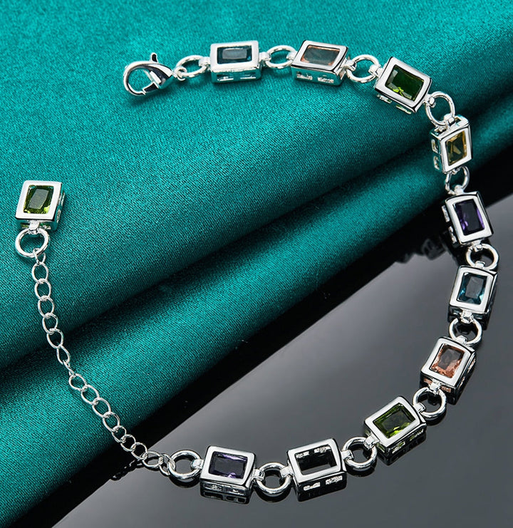 Close-up of a sparkling multicoloured zircon sterling silver bracelet for women. Elegant fashion accessory.