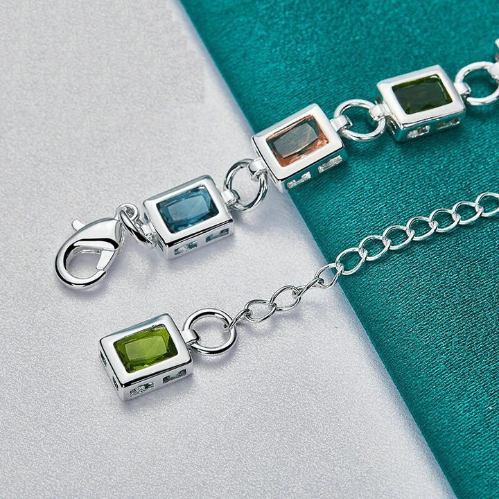 Beautiful women's sterling silver bracelet adorned with shimmering multicolour zircon stones. Adjustable design.