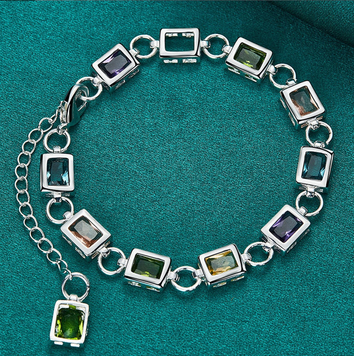 Elegant women's multicolor zircon and sterling silver bracelet. A sparkling fashion accessory for any outfit.