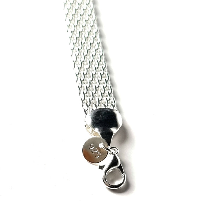 Unique handcrafted silver braided bracelet, a meaningful lucky charm gift for women seeking positivity.