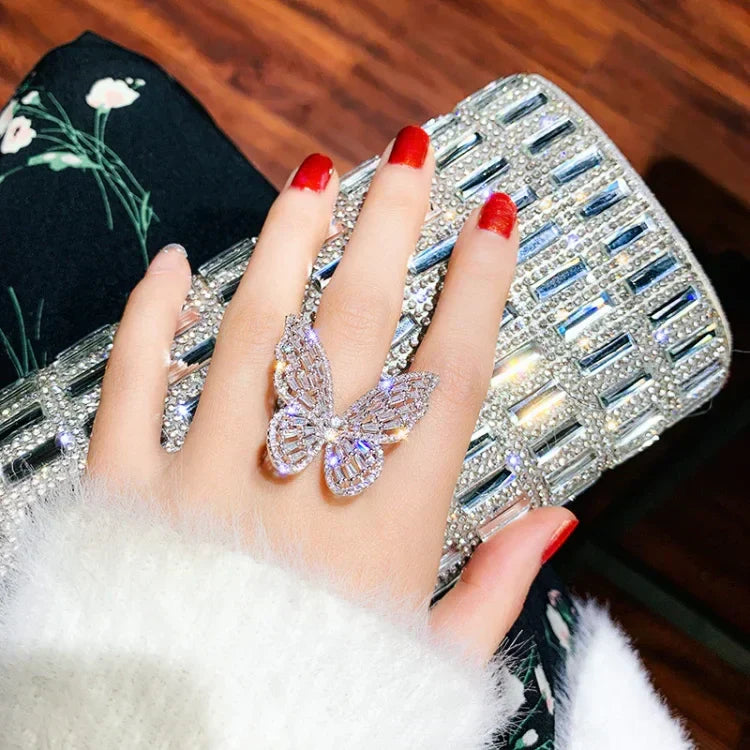 Women's sterling silver butterfly ring with sparkling crystals. A delicate and elegant fashion jewelry piece.