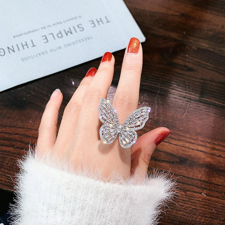 Close-up of a sparkling crystal butterfly ring in sterling silver, designed for women. Delicate and eye-catching jewelry.