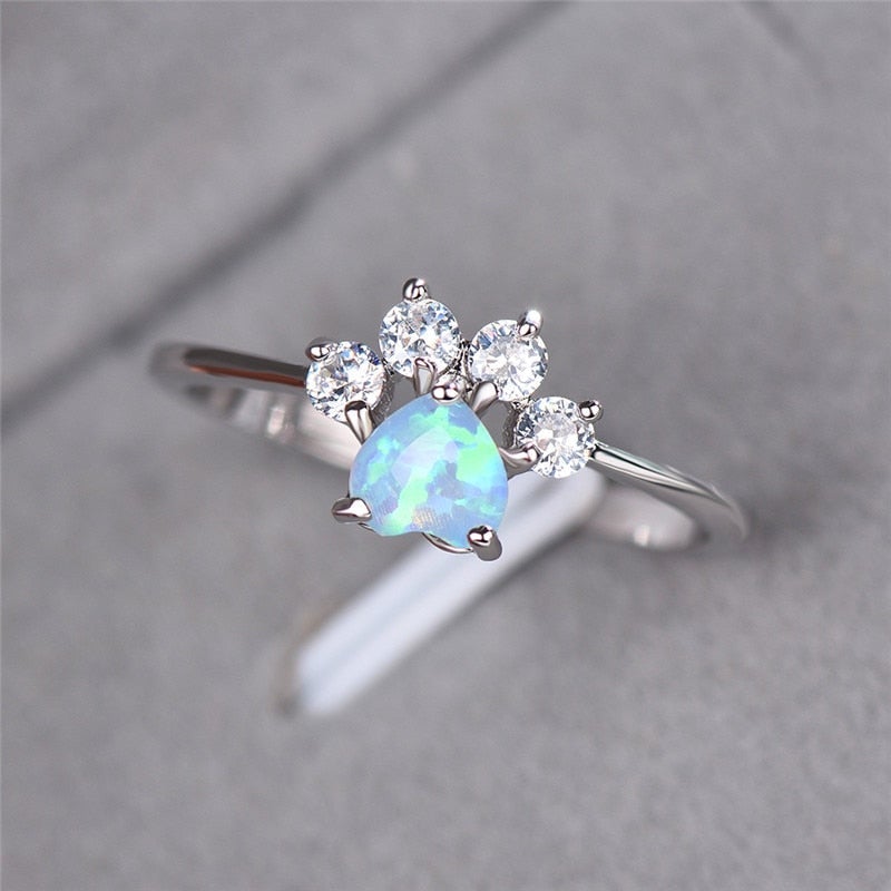 Women's sterling silver Celestine ring with iridescent opal and sparkling zirconia gemstones. Elegant gift for her.