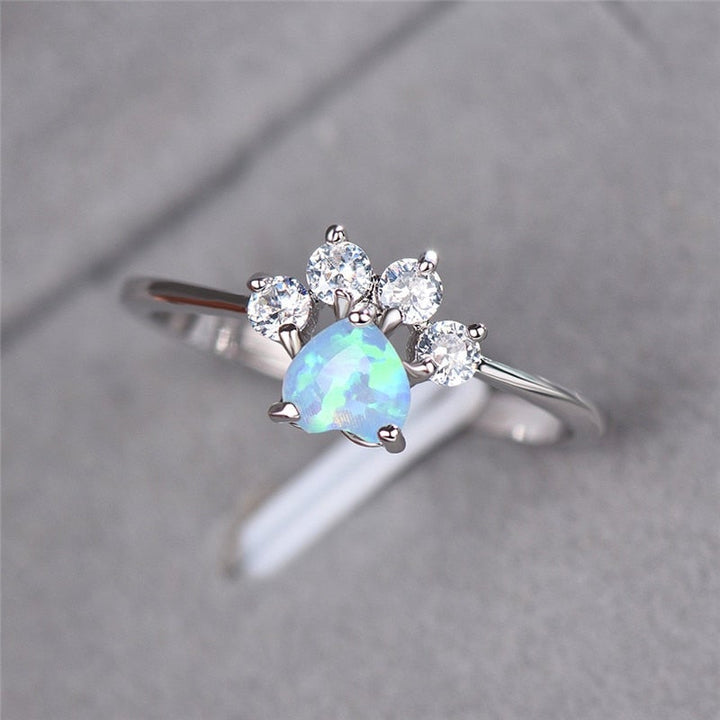 Women's sterling silver Celestine ring with iridescent opal and sparkling zirconia gemstones. Elegant gift for her.