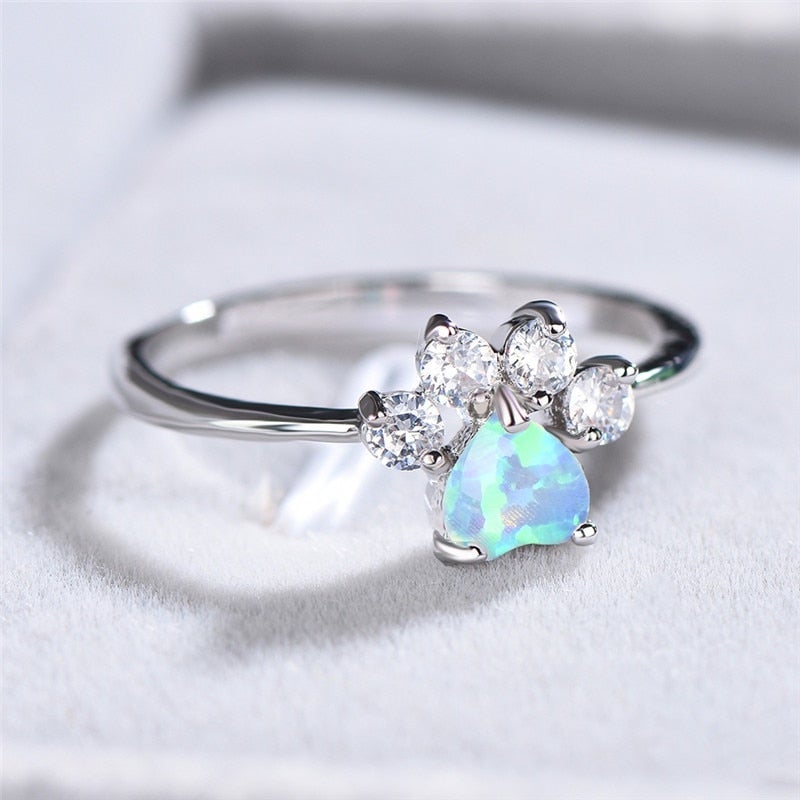 Sterling silver women's Celestine ring with dazzling opal and shimmering zirconia stones. Elegant and timeless jewelry.