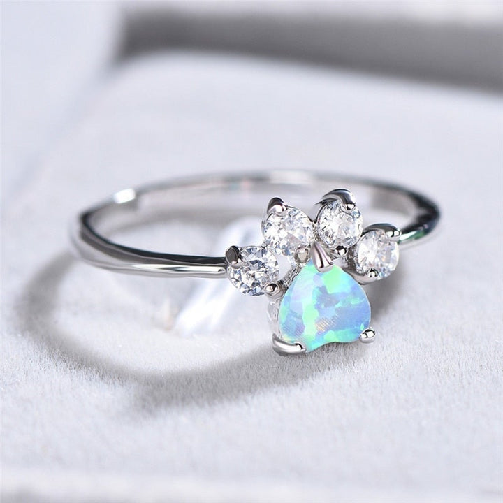Sterling silver women's Celestine ring with dazzling opal and shimmering zirconia stones. Elegant and timeless jewelry.