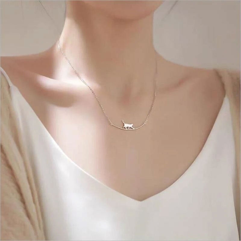Women's sterling silver climbing cat necklace, dainty feline pendant jewelry, perfect for cat lovers.