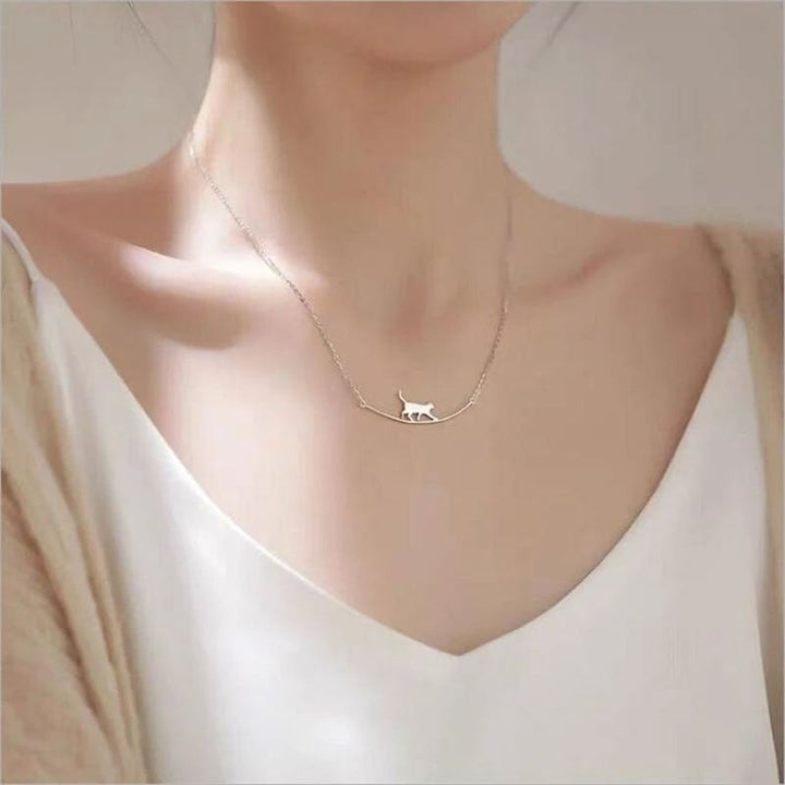 Women's sterling silver climbing cat necklace, dainty feline pendant jewelry, perfect for cat lovers.