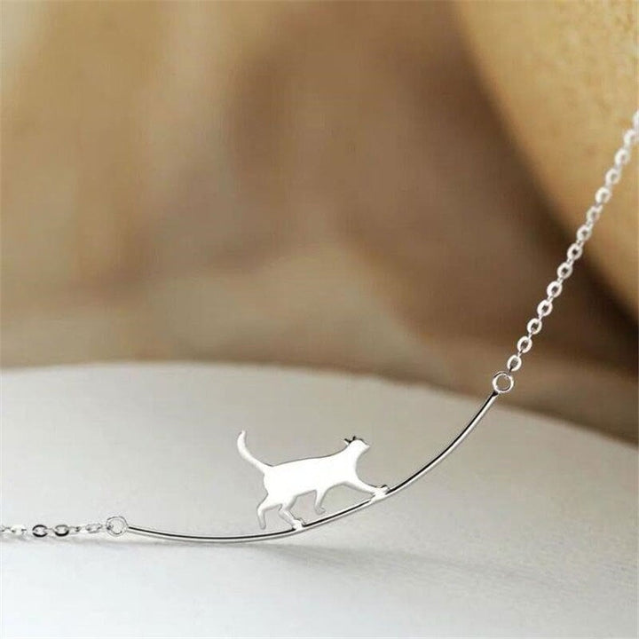 Unique sterling silver climbing cat necklace, an ideal gift for cat lovers. Women's dainty feline charm.