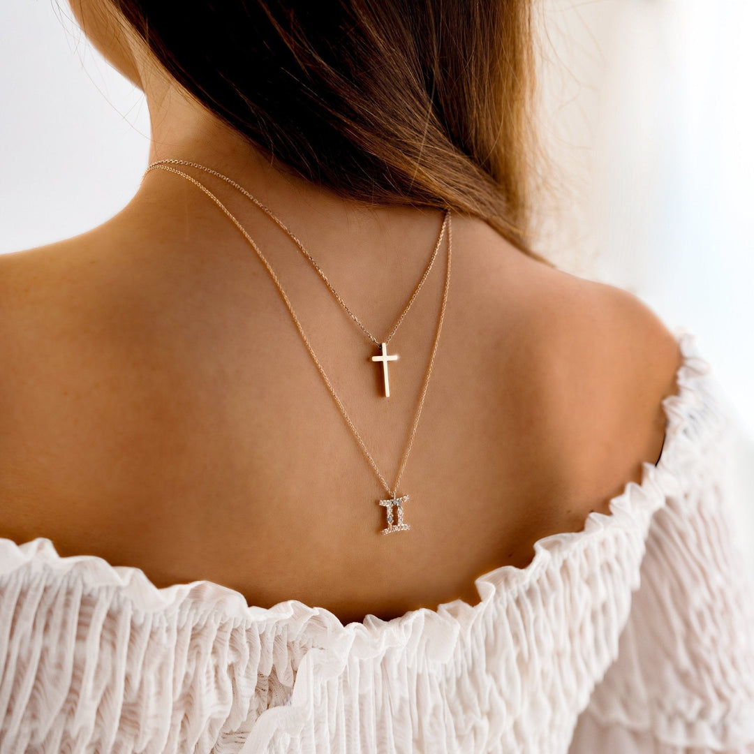 Elegant women's sterling silver cross pendant necklace, perfect for spiritual expression. Dainty and shimmering.
