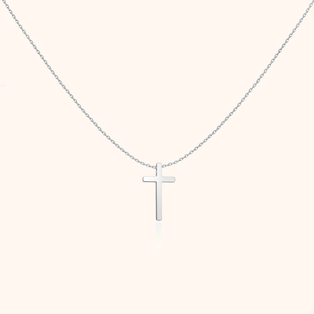 Versatile women's sterling silver cross necklace with a polished pendant. Everyday spiritual jewelry fashion.