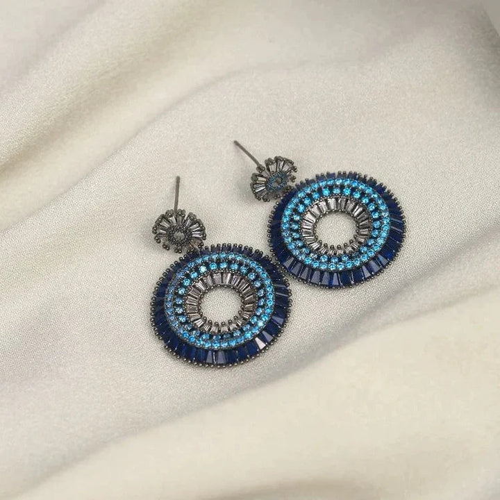 Women's protective evil eye stud earrings in sterling silver, delicate and fashionable hypoallergenic jewelry