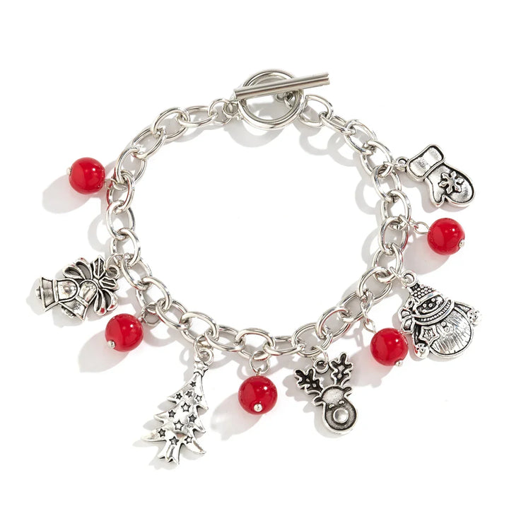 Women's sterling silver festive charm bracelet with holiday charms, a perfect Christmas jewelry accessory.