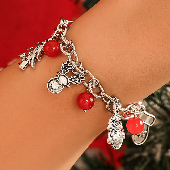 Adjustable silver charm bracelet for women, featuring festive holiday-themed charms, ideal seasonal jewelry.