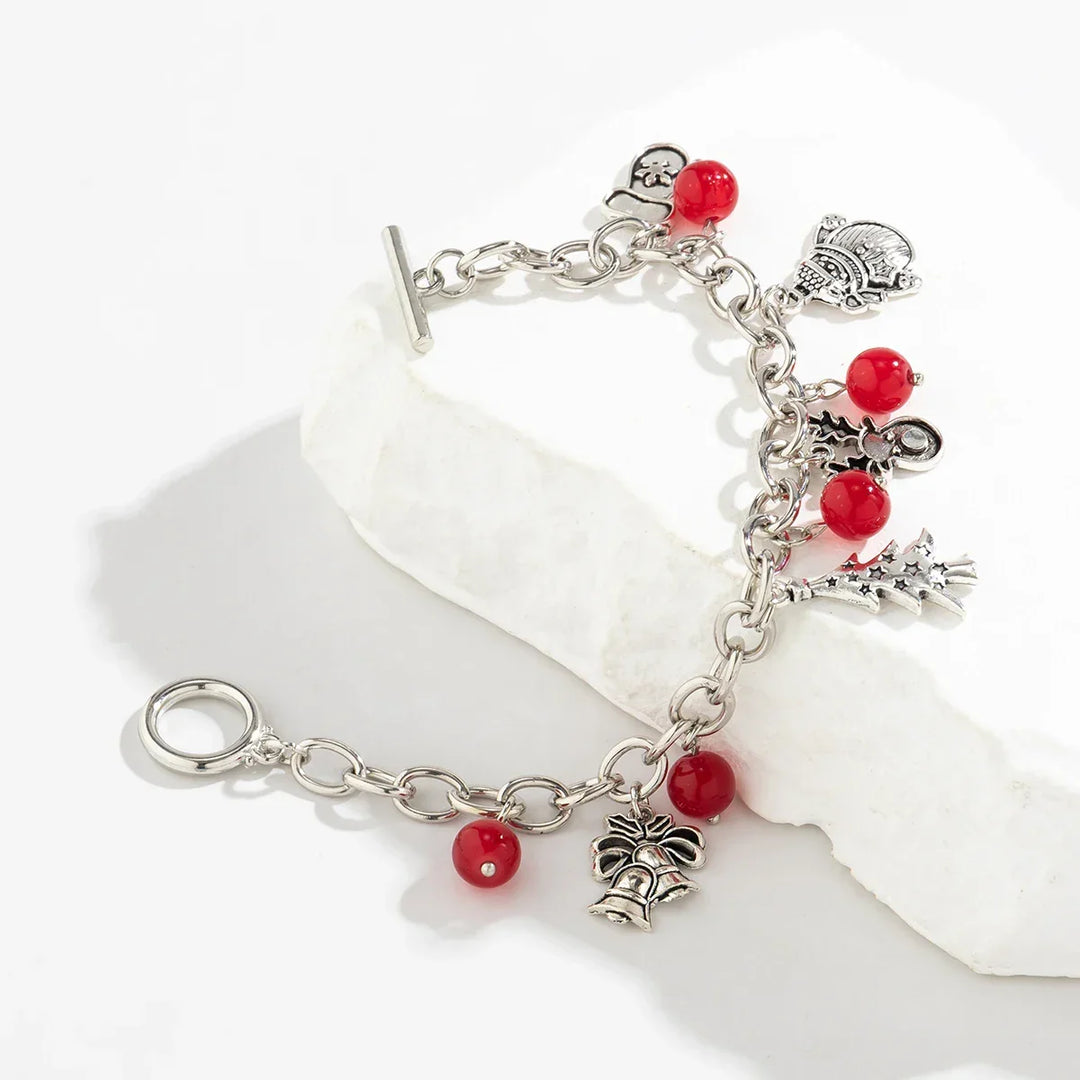 Elegant women's festive silver charm bracelet, perfect as Christmas jewelry or a thoughtful holiday gift.