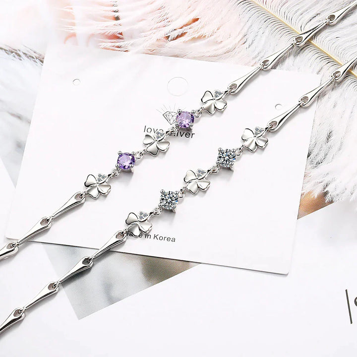 Stylish women's good luck bracelet with a sterling silver four-leaf clover charm, adjustable and chic.