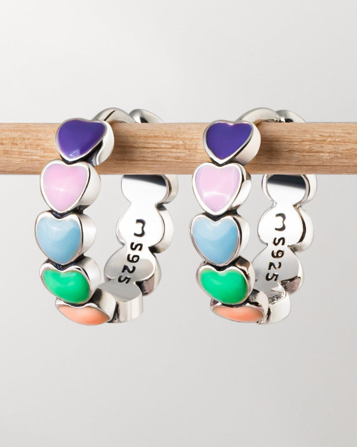 Colorful rainbow heart drop earrings for women. Dainty sterling silver & gold plated jewelry, perfect for any outfit.