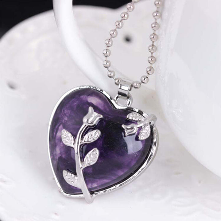 Heart-shaped amethyst gemstone necklace for women. Sterling silver, adjustable fine jewelry.