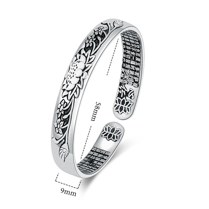 Adjustable silver lotus bracelet for women, showcasing delicate craftsmanship and serenity.