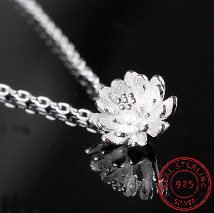 Women's sterling silver lotus flower pendant necklace, an elegant nature-inspired jewelry piece. Perfect gift.