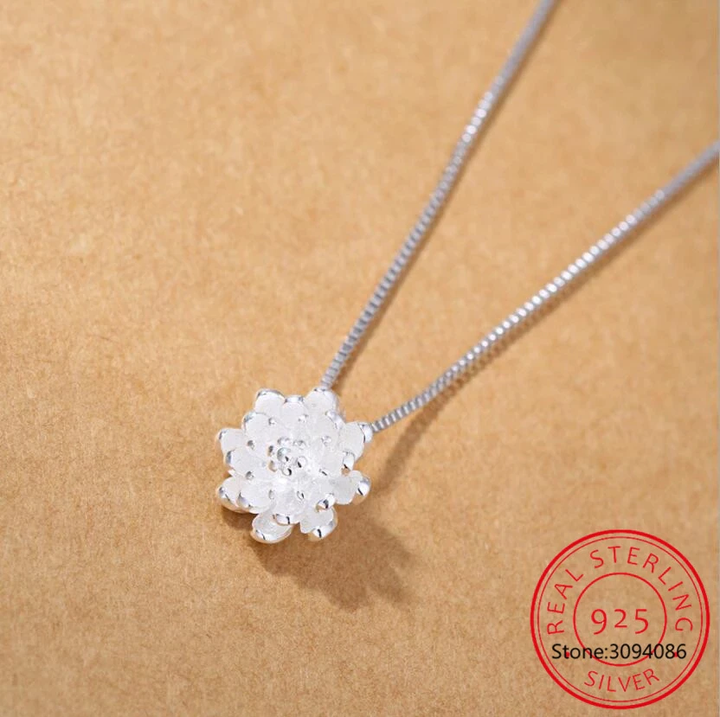 Stylish women's sterling silver lotus flower pendant necklace. Elegant and nature-inspired, perfect for daily wear or special gifts.