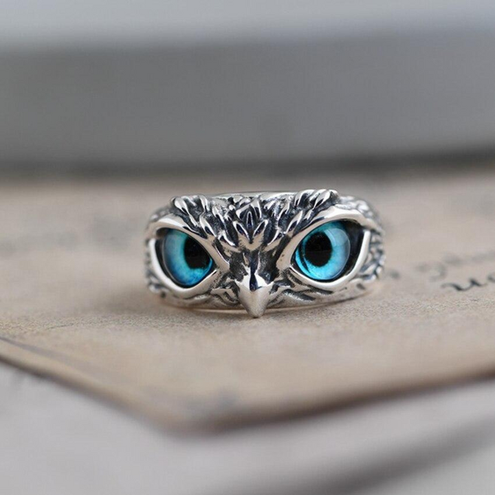 Women's sterling silver owl charm ring with a vibrant opal gemstone, adjustable for a perfect fit. Animal jewelry.