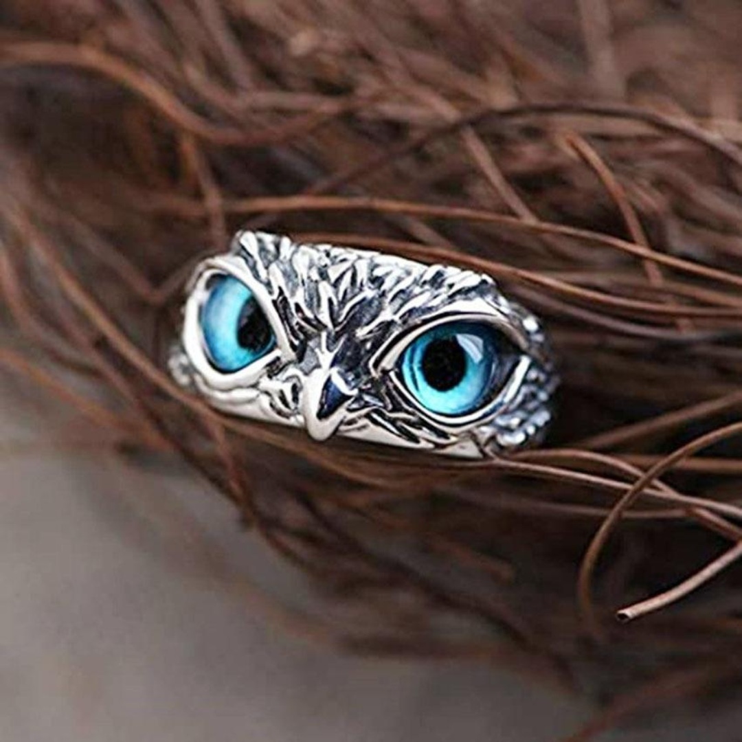 Detailed sterling silver owl ring adorned with a captivating opal gemstone, an adjustable women's fashion accessory.