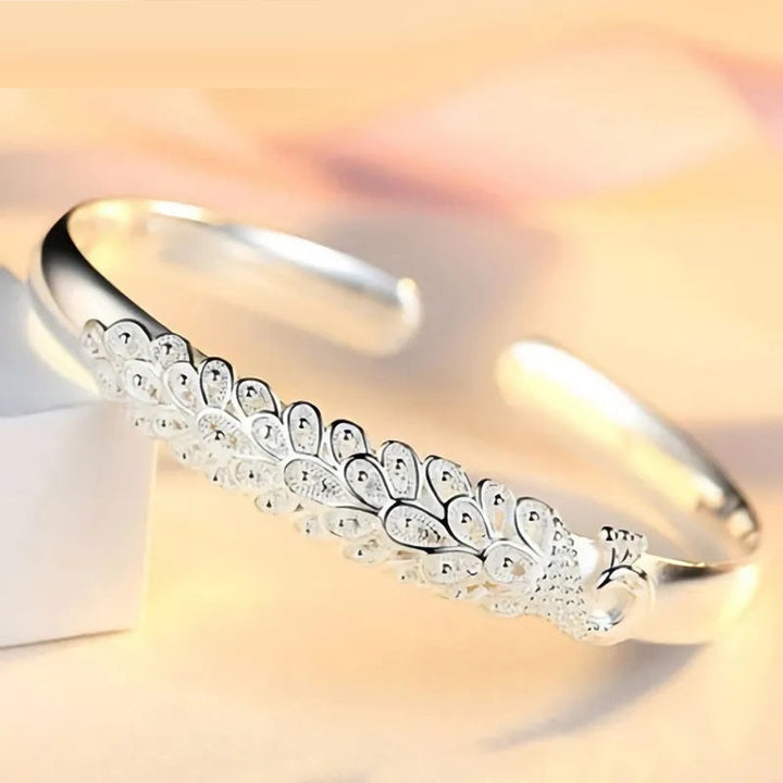 Women's animal jewelry: an elegant sterling silver bracelet with a charming peacock design, a great gift.